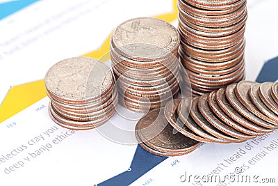 Financial documents on a pile of dollar coins Stock Photo