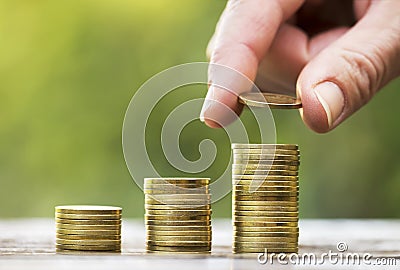 Financial freedom concept, hand and money coins Stock Photo