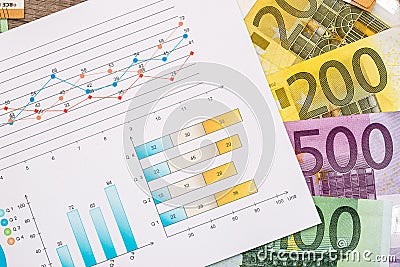 Financial graphics with euro banknotes Stock Photo