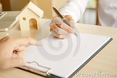 Financial inspector making report,insurance agent analyzing about home investment loan at office room Stock Photo