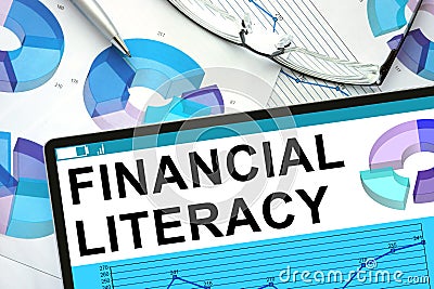 Financial Literacy on tablet with graphs. Stock Photo