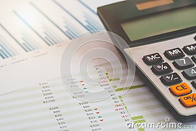 Financial Management concept, Calculator and many documents of personal budget with a laptop on the table. Stock Photo