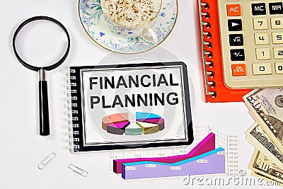 Financial planning. A text label in a working notebook. Stock Photo