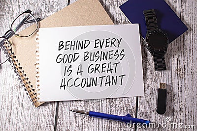 Financial quote Behind Every Good Business Is A Great Accountant handwritten on yellow sticky note on laptop keyboard Stock Photo