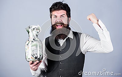 Financial success. Businessman with his dollar savings. Richness and wellbeing. Security and cash money savings. Banking Stock Photo