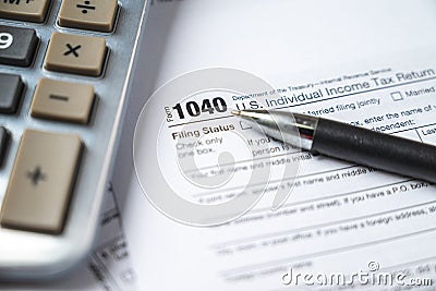 Financial time tax return forms with pen and calculator Editorial Stock Photo