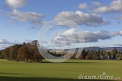 Finavon Castle nestled in the mixed Woodland and farmland of the Strathmore Valley. Editorial Stock Photo