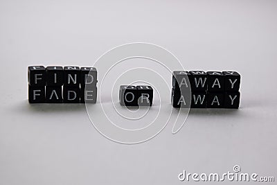 Find away or fade away on wooden blocks. Motivation and inspiration concept Stock Photo