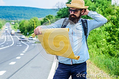 Find direction map large sheet of paper. Where should I go. Tourist backpacker map lost direction travelling. Around the Stock Photo