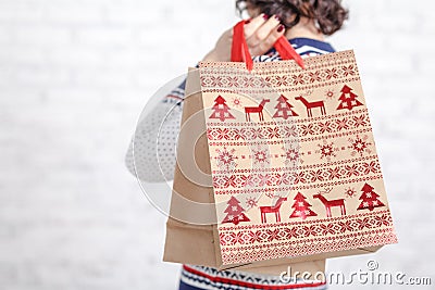 Find idea for gift, shopping bag in female hand Stock Photo