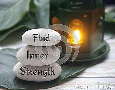 Find inner strength words engraved on zen stones. Motivational concept Stock Photo