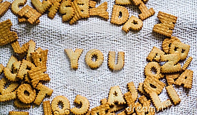 Find you Cookies in the form of the alphabet prospe words from homemade cookies on dark white background Stock Photo