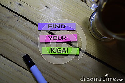 Find Your Ikigai text on sticky notes isolated on Table background. Japanese concept Stock Photo