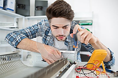 Finding defective part appliance Stock Photo