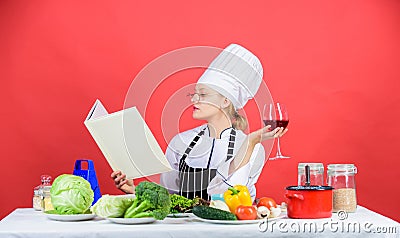 Finding recipe for every occasion. Lady cook looking for cooking recipe in cookbook. Pretty woman reading recipe book in Stock Photo