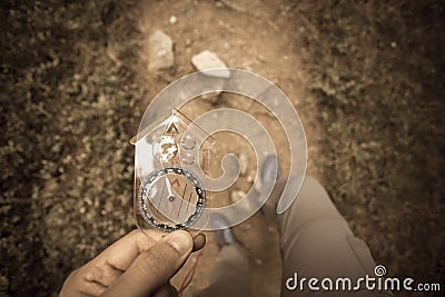 Finding the right position in the forest with a compass, vintage Stock Photo