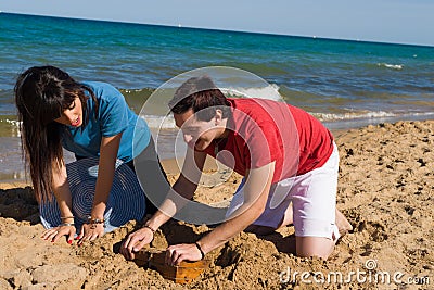 Finding a treasure on the sand Stock Photo