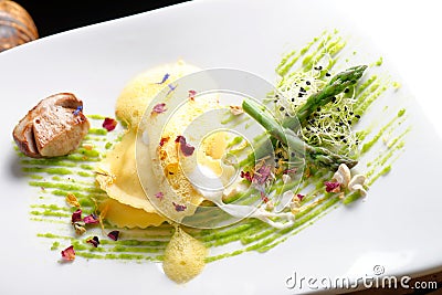 Fine dining, ravioli with asparagus and Porcini Stock Photo