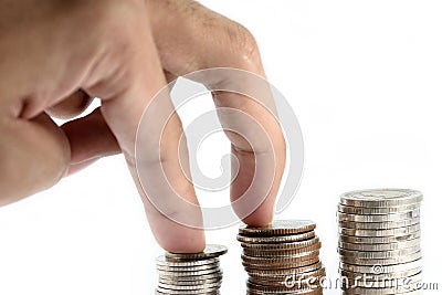 The finger act was walking steadity on silver coins paste is in line as a discipline. Stock Photo