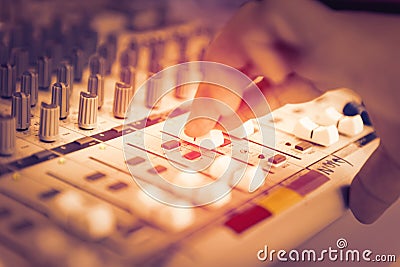 Engineer or music producer controlling sound recording studio mixing desk Stock Photo