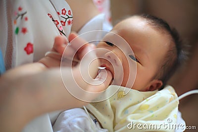 Finger Feeding breast milk by tube Stock Photo