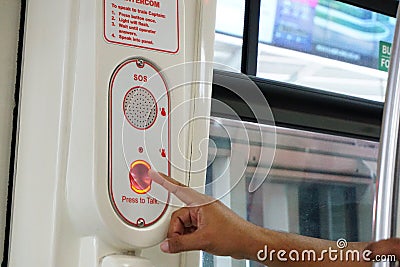 Finger hand pressing red button for emergency Stock Photo