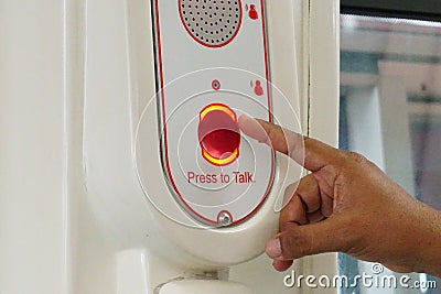 Finger hand pressing red button for emergency Stock Photo