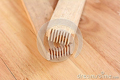 Finger joint at the end of wood sticks - one of woodworking joint Stock Photo