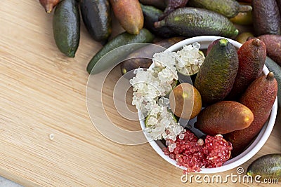 Finger lime or caviar lime of Australian cut in half, it is edible fruits used for cooking gourmet cuisine. Fresh Citrus Stock Photo