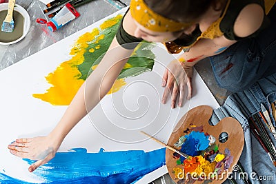 Finger painting hobby artist blue yellow artwork Stock Photo