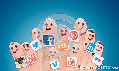 Finger with popular social media logos printed on paper. Editorial Stock Photo