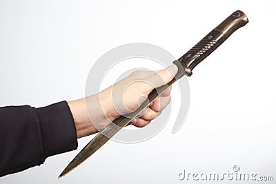 Finger position when throwing knives and daggers by long blade Stock Photo