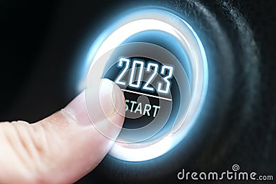 Finger press ignition button with the text 2023 start. business start-up concept Stock Photo