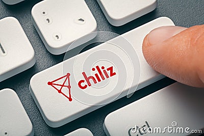 Finger pressing computer key with chiliz altcoin logo Editorial Stock Photo