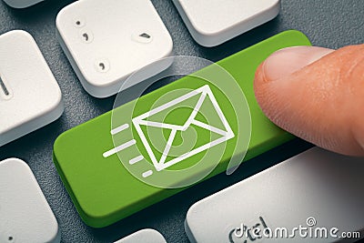 Finger pressing computer key with e-mail symbol Stock Photo