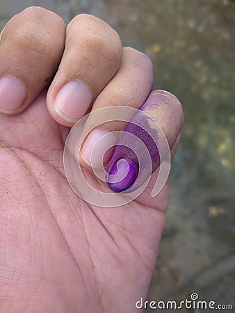 A Finger with purple tinted Stock Photo