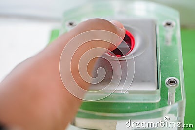 Finger touches on the fingerprint scanner Stock Photo