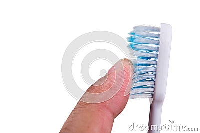 Finger touching soft and slim tapered toothbrush bristle Stock Photo