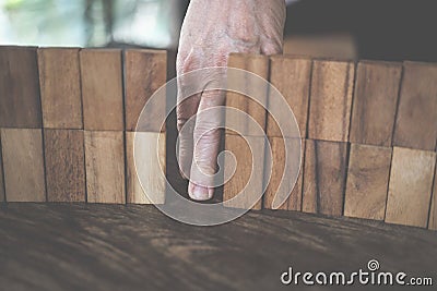 finger walk through wall made by wood block. problem & solution Stock Photo