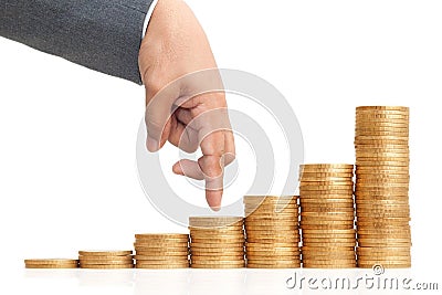 Finger walking on heap of coins Stock Photo