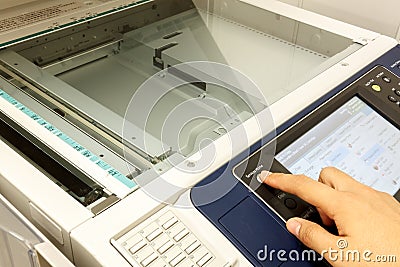 Finger's someone is pushing switch copy machine.non-English text Stock Photo