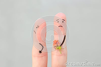 Fingers art of couple. Man gives a woman a bouquet of flowers, she is not satisfied Stock Photo