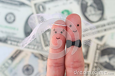 Fingers art of a Happy couple. Bride and groom hug on background of money. Stock Photo