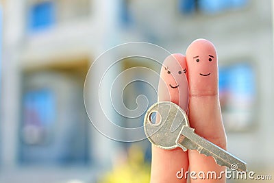 Fingers art of happy couple. Family holds house key Stock Photo