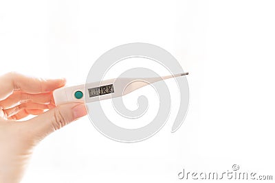 The fingers of a female hand are holding an electronic thermometer with the word Work on the scoreboard on a white background. Stock Photo