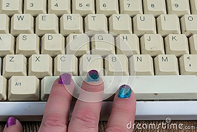 Fingers on keyboard spacebar Stock Photo