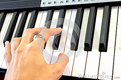 Fingers play chords on synthesizer keys piano playing pianist music Stock Photo