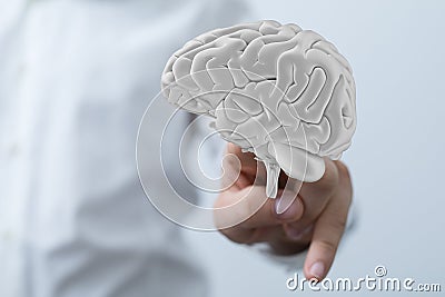 Fingers touching a 3D rendered human brain - innovation, inspiration mind concept Stock Photo