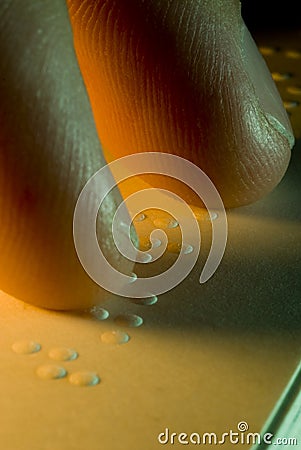 Fingertips and Braille Macro Stock Photo