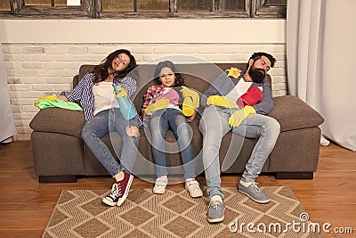 Finish cleaning. Cleaning all day exhausting occupation. Tired parents and kid. Exhausting cleaning day. Family mom dad Stock Photo